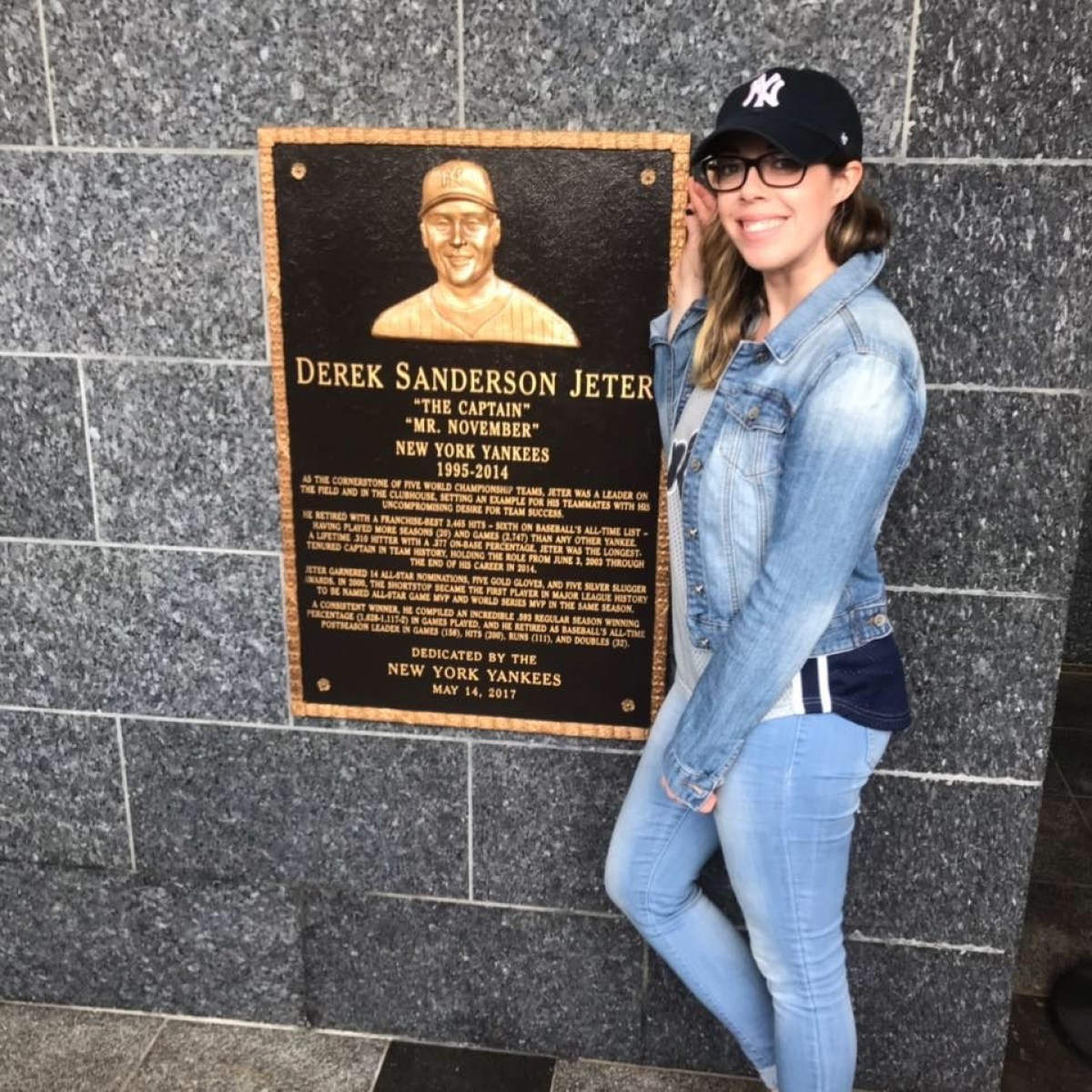 a woman standing in front of a building