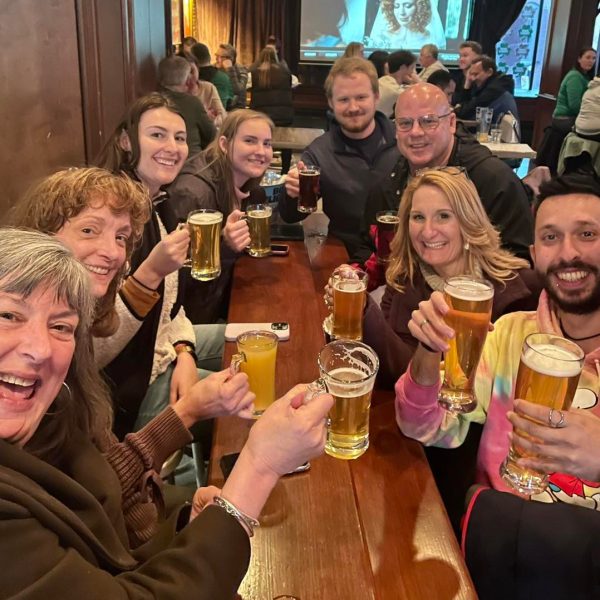 a group of people sitting at a table with wine glasses